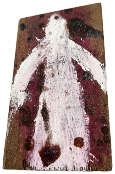a white figure, arms out, on a board stained dark red