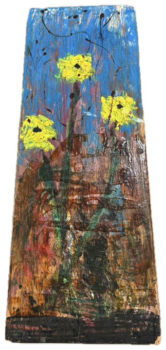 a tall board in blue with yellow flowers and a scatter of red and green